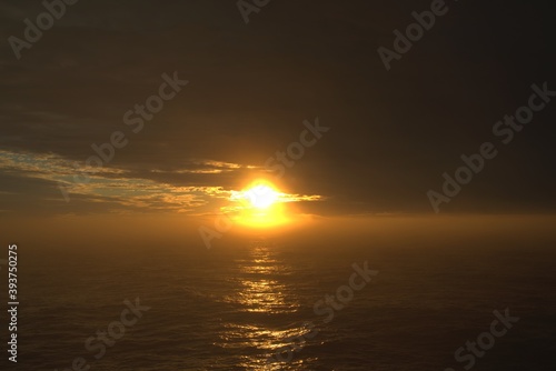Cloudy sunset during Antarctic voyage.