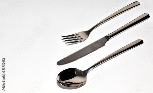 Cutlery Silverware Set with Spoons, forks, steak knives isolated on white background with copy space. Selective Focus.