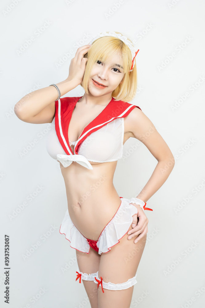 Naklejka premium Sexy Asian woman portrait of attractive female model with slim figure,Sexy woman in lingerie standing in seductive pose.