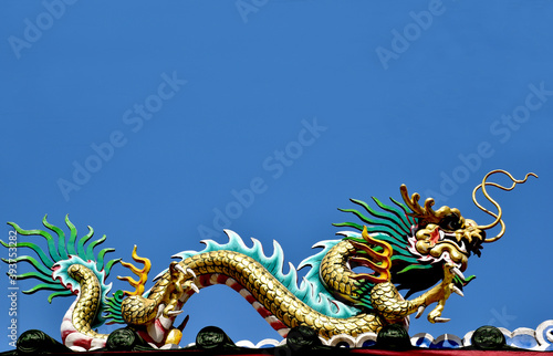 Wallpaper Mural Colorful Dragon Decoration with blue sky background at Chinese Temple, Thailand. Torontodigital.ca
