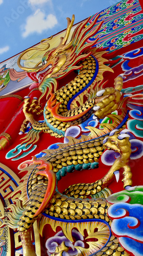 Colorful Dragon Decoration on festive background at Chinese Temple, Bangkok, Thailand. © masterjew