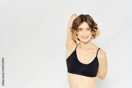 Woman in sportswear on a light background exercise fitness sport balance model © SHOTPRIME STUDIO