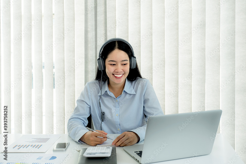 Businesswoman analysis the chart and meeting Video Conferencing with laptop at the home office for setting challenging business goals And planning to achieve the new target Businesswoman analysis the chart and meeting Video Conferencing with laptop at the home office for setting challenging business goals And planning to achieve the new target