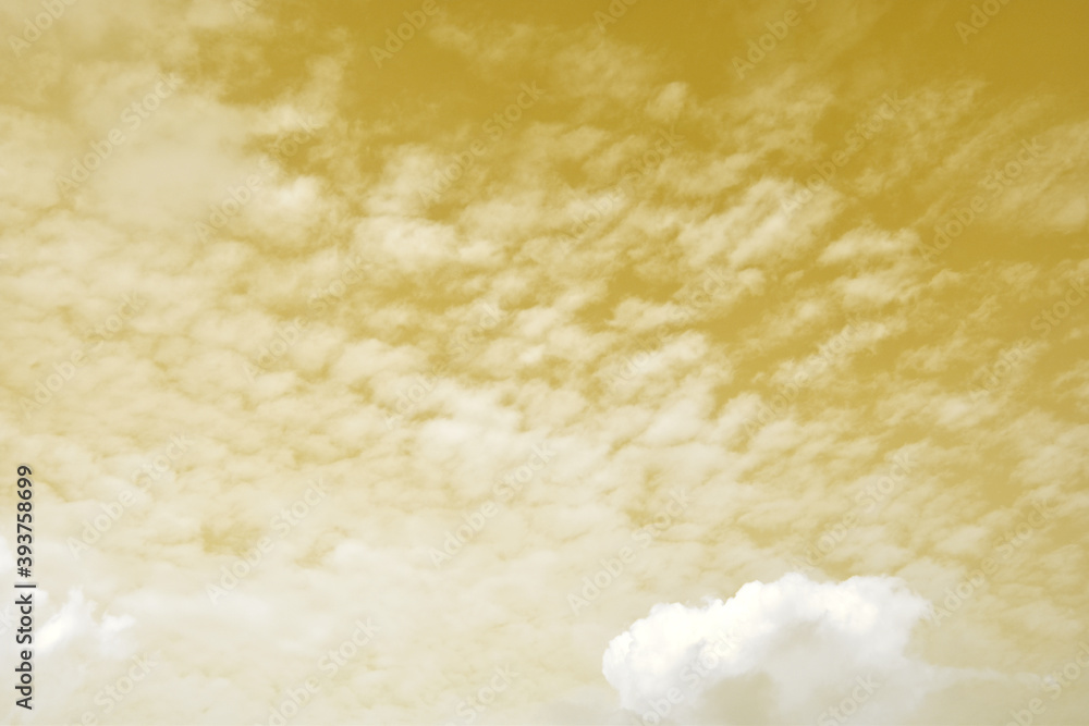 Golden sky with white clouds. Beautiful sky background and wallpaper for design and texture background. Golden sky with white clouds. Beautiful sky background and wallpaper for design and texture background.