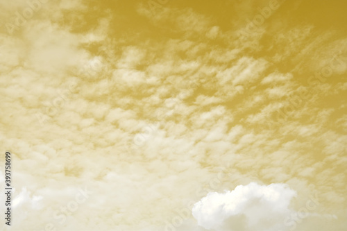Golden sky with white clouds. Beautiful sky background and wallpaper for design and texture background.