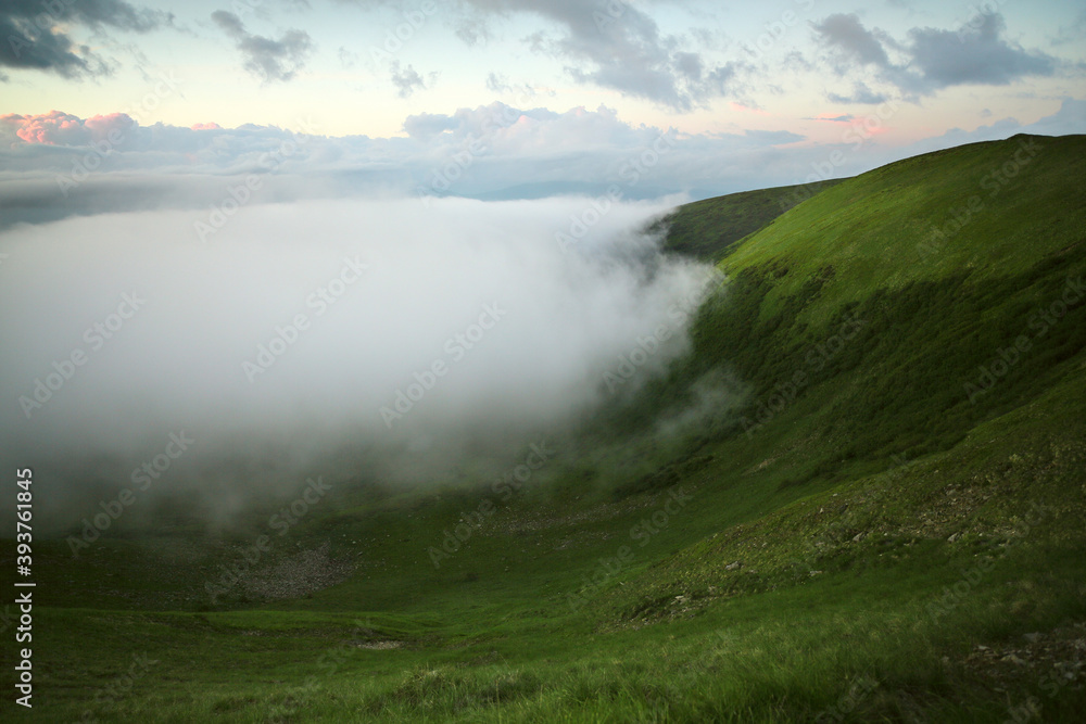 Panoramic view of the clouds high in the mountains on the mountain pass. Panoramic view of the clouds high in the mountains on the mountain pass.