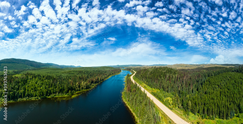 Scenic Panoramic Lake View of Curvy Road in Canadian Nature on a Sunny Summer Day. North of Prince George, John-Hart Highway, British Columbia.