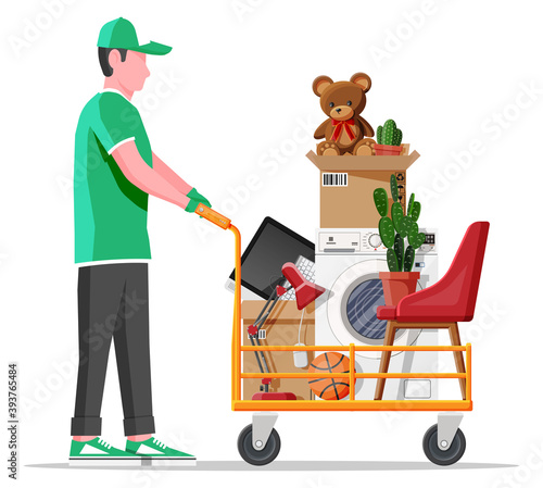 Male mover, hand truck and package for transportation. Moving to new house. Family relocated to new home. Paper cardboard boxes with various household thing. Vector illustration in flat style