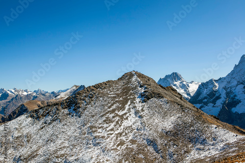 The peaks of the Mussa-Achitara and Dombay-Ulgen mountains. Dombay. Karachay-Cherkessia. Russia photo