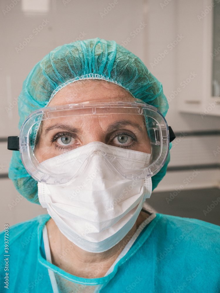 Hospital worker person with protective equipment for coronavirus Covid 19
Hospital worker person with protective equipment for coronavirus Covid 19