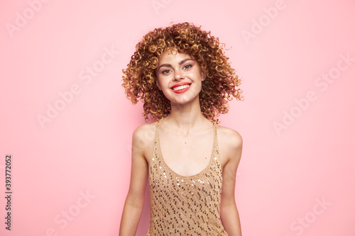 Model charming smile and sequin tank top fashion clothes pink background