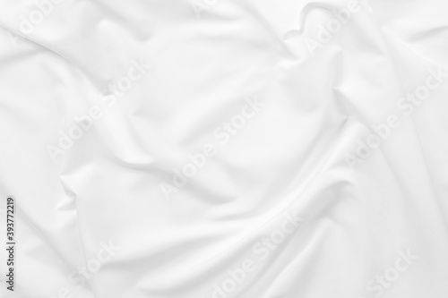 Abstract white fabric texture background. Cloth soft wave. Creases of satin. silk and cotton.