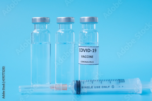 COVID-19 Vaccine vial and injection Needle Syringe against Coronavirus infection in hospital laboratory. Medical, health, Vaccination and immunization concept