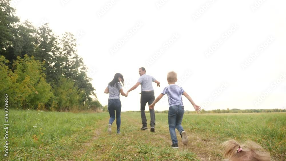 happy family children kid together run in the park at sunset silhouette. people in park concept mom dad daughter and son joyful run. happy family and little fun baby child summer kid dream concept happy family children kid together run in the park at sunset silhouette. people in park concept mom dad daughter and son joyful run. happy family and little fun baby child summer kid dream concept