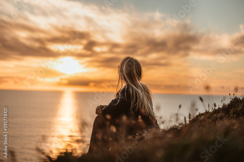 woman on the beach at sunset © Marijus