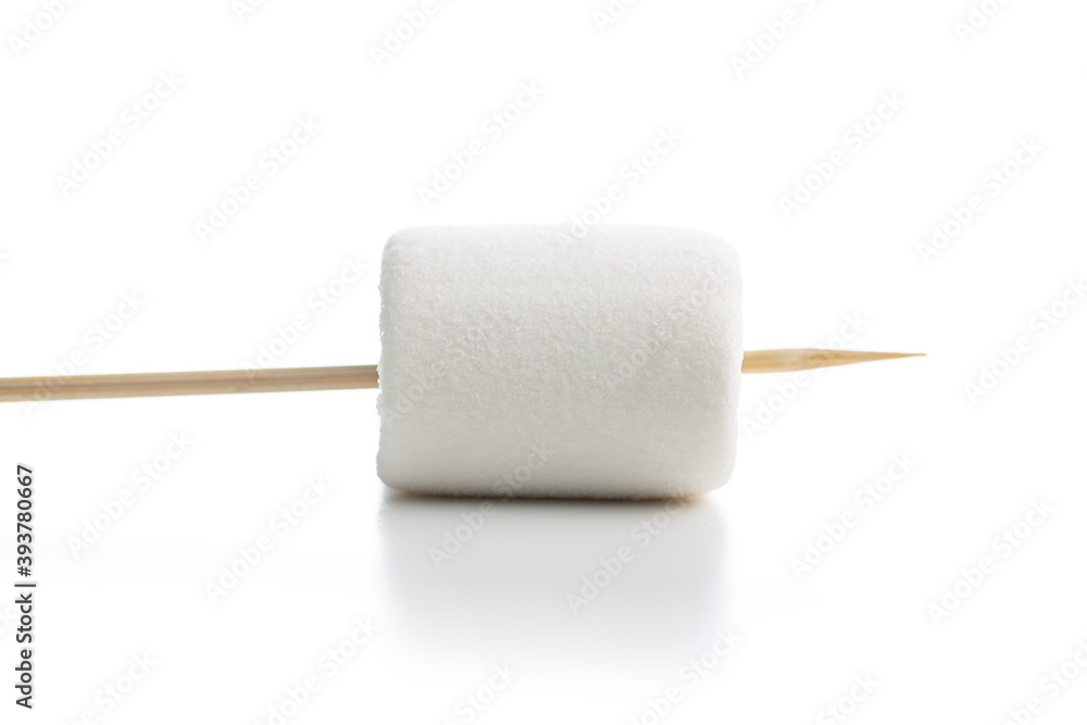 White sweet marshmallows candy on a wooden sticks White sweet marshmallows candy on a wooden sticks