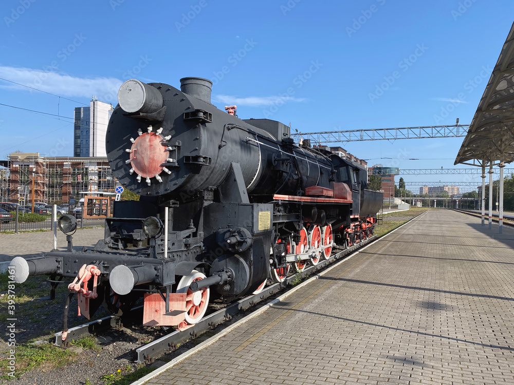 Fototapeta premium Monument to the steam locomotive of the TE series 858 on the platform Kaliningrad, Russia, built in Germany in 1943