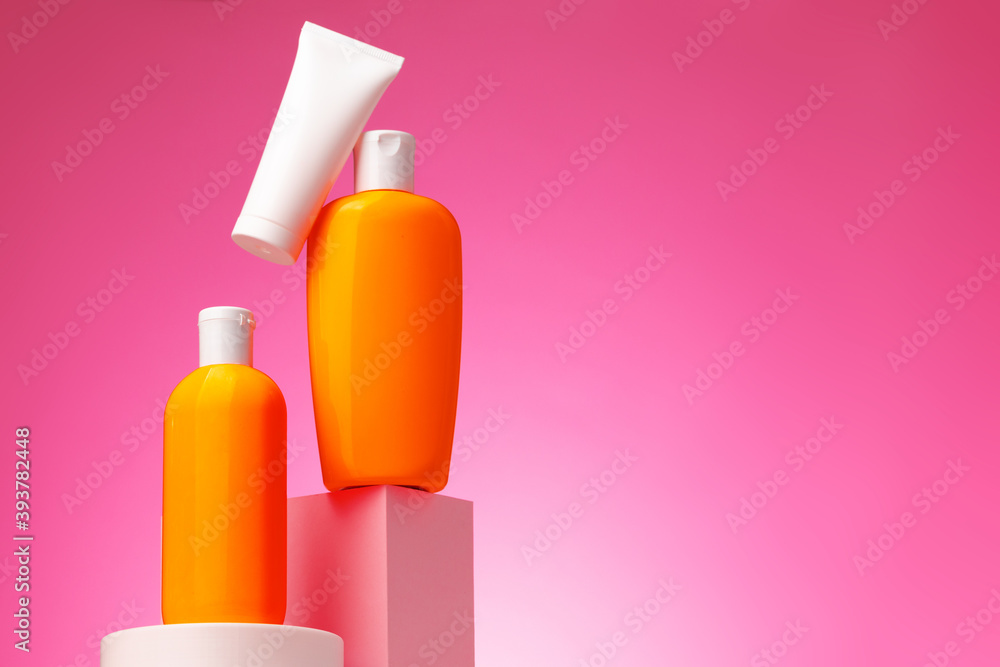 Skincare beauty products container against pink background Skincare beauty products container against pink background