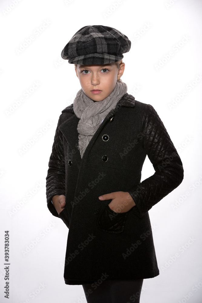 beautiful girl in a gray coat and a checkered cap on a white background beautiful girl in a gray coat and a checkered cap on a white background