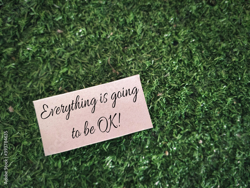 Motivational and inspirational quote - everything is going to be ok text written on paper background. Stock photo. © Frederica Aban
