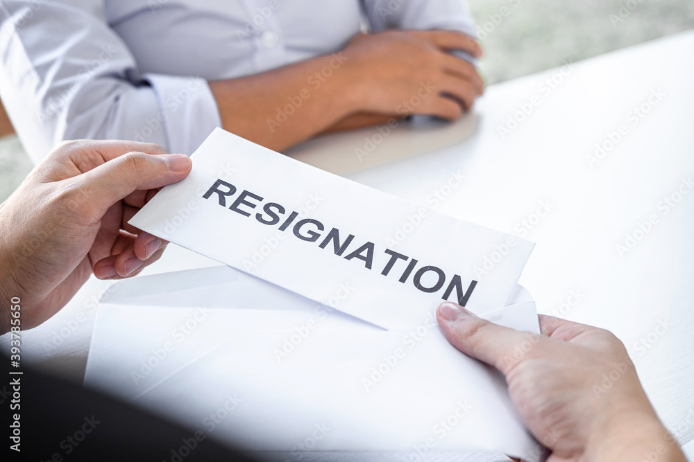 Image of business woman hand sending a resignation letter to executive boss, Change of job, unemployment, resign concept Image of business woman hand sending a resignation letter to executive boss, Change of job, unemployment, resign concept