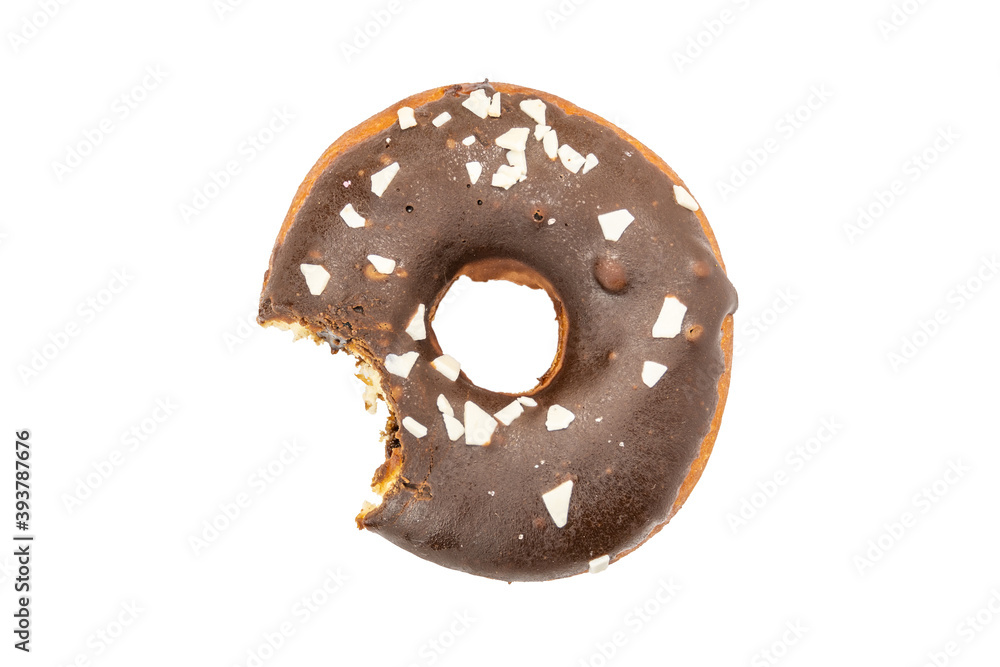 Bitten donut in chocolate glaze, sprinkled with pieces of white chocolate, isolated on white background. Bitten donut in chocolate glaze, sprinkled with pieces of white chocolate, isolated on white background.