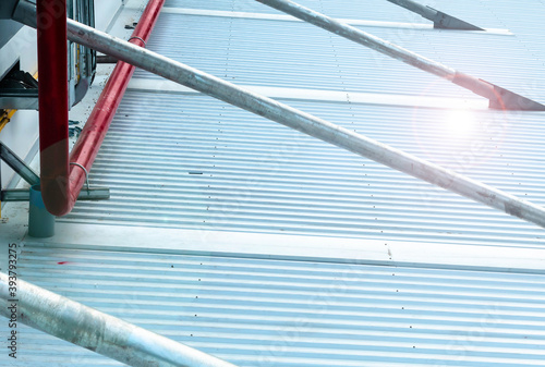 Architectural detail of metal roofing on commercial construction

 photo