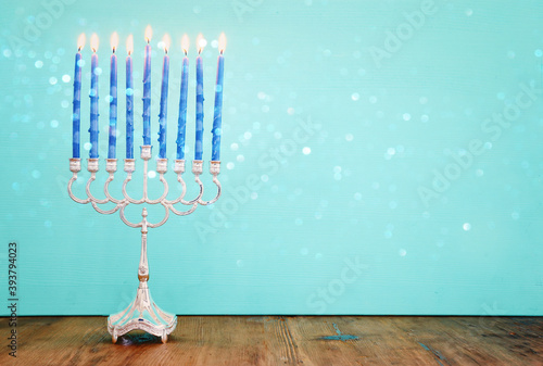 Religion image of jewish holiday Hanukkah background with menorah (traditional candelabra) and candles
