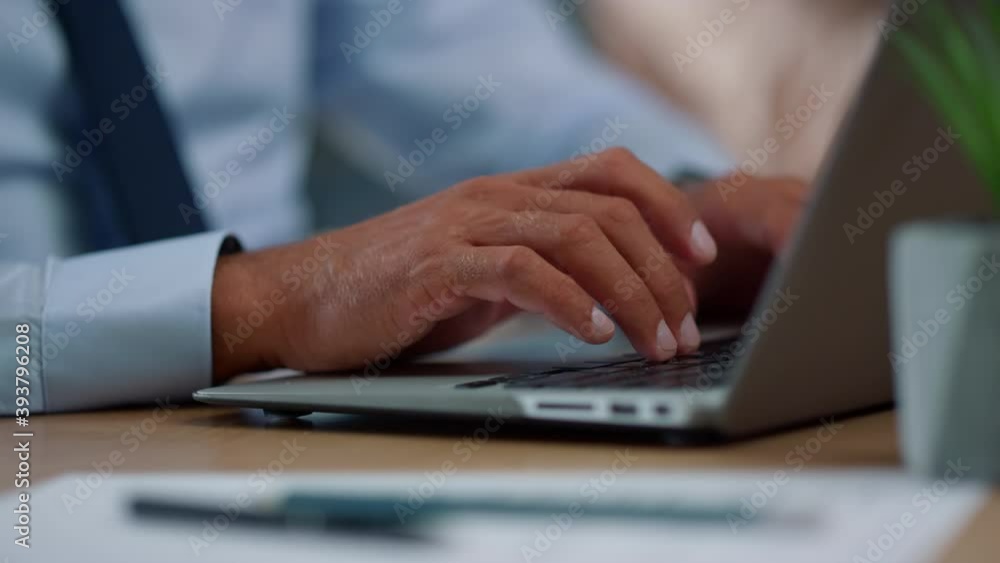 Businessman hands typing on laptop computer. Professional using modern computer Businessman hands typing on laptop computer. Professional using modern computer