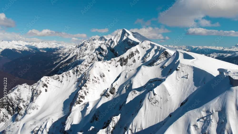 Aerial view of idyllic arctic landscape. Adventure, travel and background concept. Drone fly over majestic winter snowy mountain peaks. Aerial view of idyllic arctic landscape. Adventure, travel and background concept. Drone fly over majestic winter snowy mountain peaks.