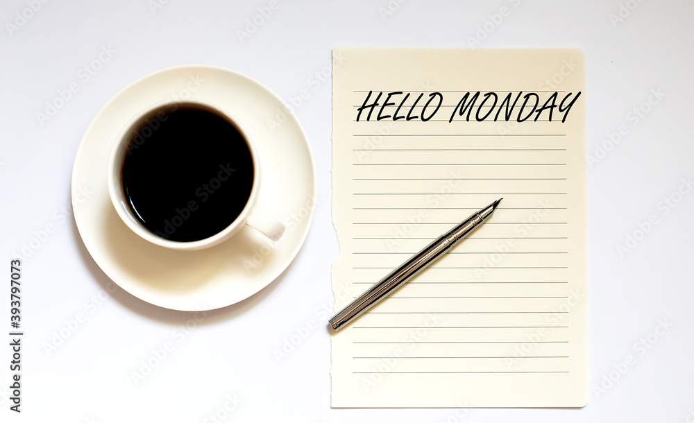 HELLO MONDAY - white paper with pen and coffee on wooden background HELLO MONDAY - white paper with pen and coffee on wooden background
