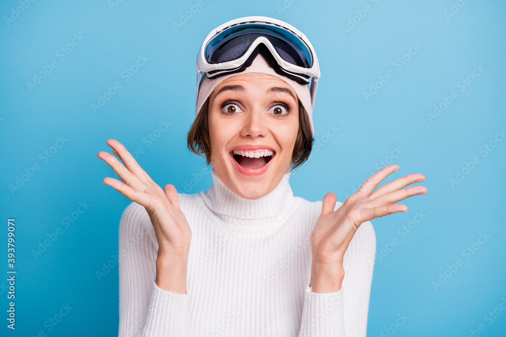 Photo of astonished delighted young woman raise hands lucky discount isolated on pastel blue color background Photo of astonished delighted young woman raise hands lucky discount isolated on pastel blue color background