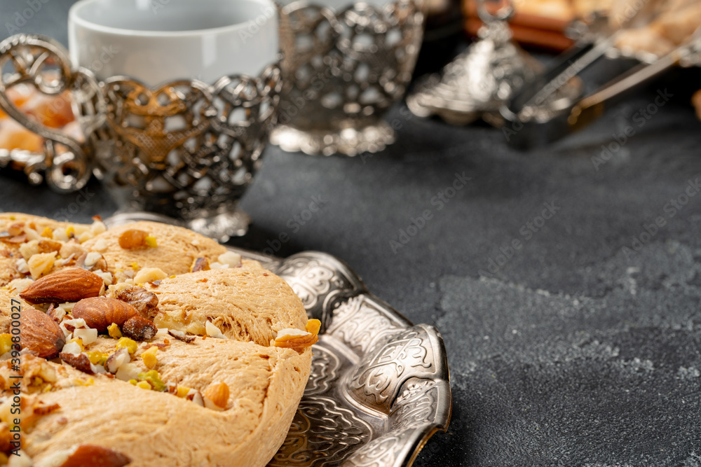Close up photo of halva dessert on silver plate Close up photo of halva dessert on silver plate