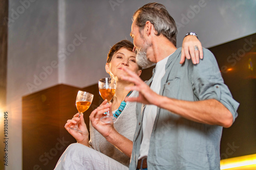 aged couple with glasses of wine
