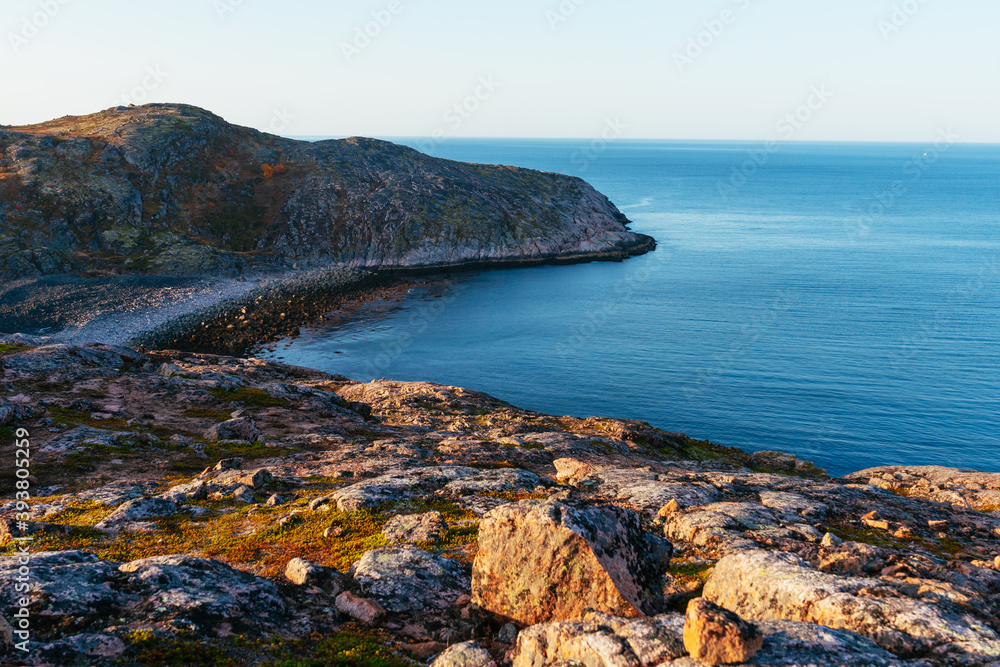 The rocky beach on the coast of the Barents Sea in the north of Russia.
Russian polar region, Kola Peninsula, overlooking the Barents sea the Arctic ocean, Murmansk oblast