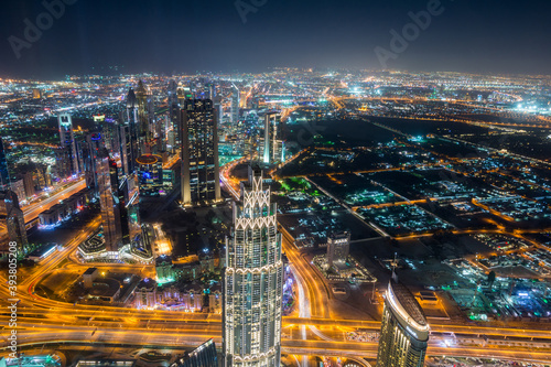 Night aerial view of Dubai from the top of  Burj Khalifa Tower in Dubai, United Arab Emirates, the tallest building in the world. photo