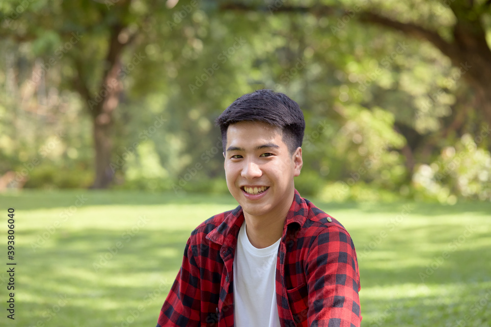 Happy Asian man backpacker in beautiful nature Happy Asian man backpacker in beautiful nature