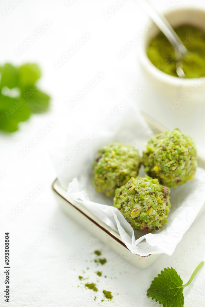 On a white table turkish sweet nuts.
Handmade pistachio dessert. On a white table turkish sweet nuts.
Handmade pistachio dessert.