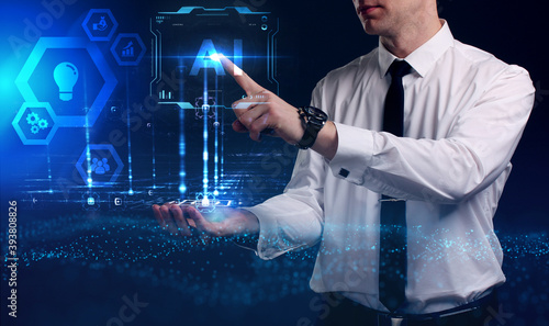 Business, Technology, Internet and network concept. Young businessman working on a virtual screen of the future and sees the inscription: AI