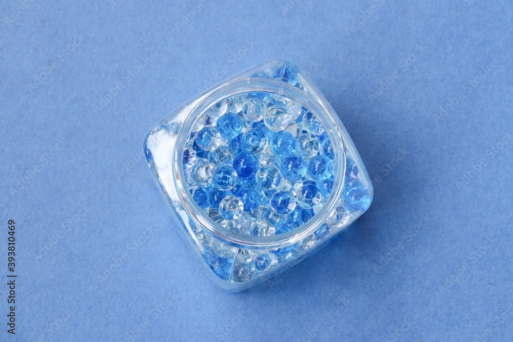 Blue gel fragrance air freshener, bathroom deodorant on blue background. Template chemical container product perfume care clean color domestic hygiene object plastic scented Blue gel fragrance air freshener, bathroom deodorant on blue background. Template chemical container product perfume care clean color domestic hygiene object plastic scented
