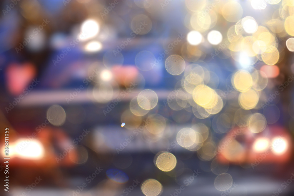 abstract blurred view of the night city from a car window, traffic in the city abstract blurred view of the night city from a car window, traffic in the city