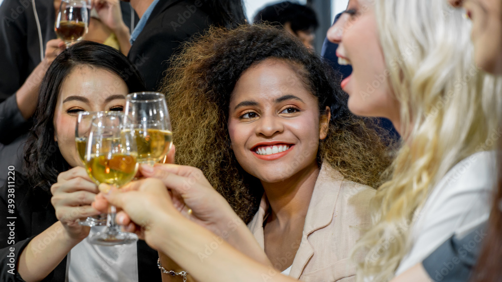 Multiethnic group of women clinking champagne glasses. Business party. Celebration of special occasion. Multiethnic group of women clinking champagne glasses. Business party. Celebration of special occasion.