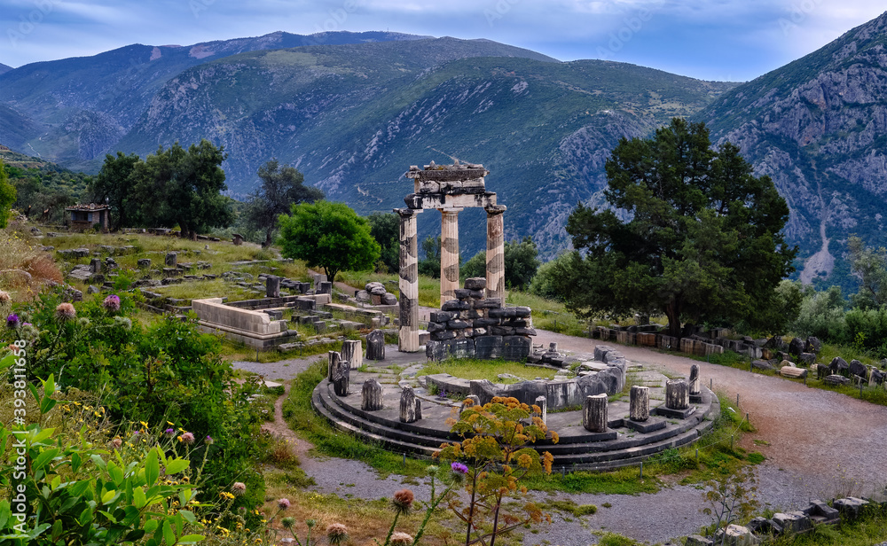 Ruins of Tholos of ancient Greek goddess Athena Pronaia in Delphi, Greece. UNESCO World heritage site. Wide downshot