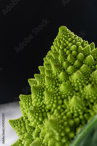 Romanesco broccoli close up. The fractal vegetable is known for it's connection to the fibonacci sequence and the golden ratio. Fun food for any practical scientists that loves mathematics