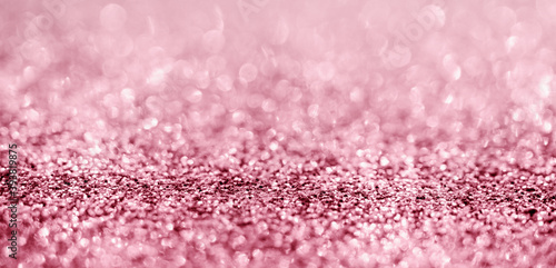 Abstract rose gold glitter sparkle texture with bokeh background