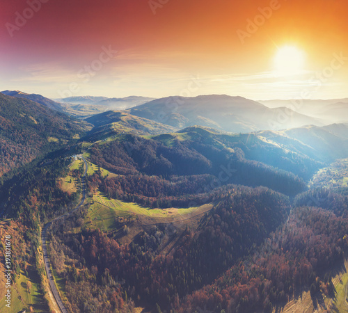 Silhouette of mountains in the early foggy morning. Mountain view in autumn. Beautiful natural landscape. View from above. Carpathian mountains. Ukraine