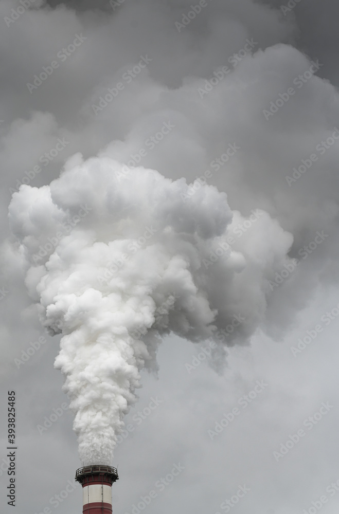 Smoking pipes of thermal power plant with dramatic dark cloudy sky Smoking pipes of thermal power plant with dramatic dark cloudy sky