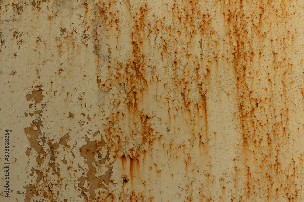 Texture of a light yellow metal plate with peeling paint, splashes and streaks of rust Texture of a light yellow metal plate with peeling paint, splashes and streaks of rust
