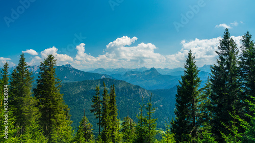 Germany, Allgaeu, View above endless mountains and peaks of alps seen from summit of edelsberg, aerial view above tree tops