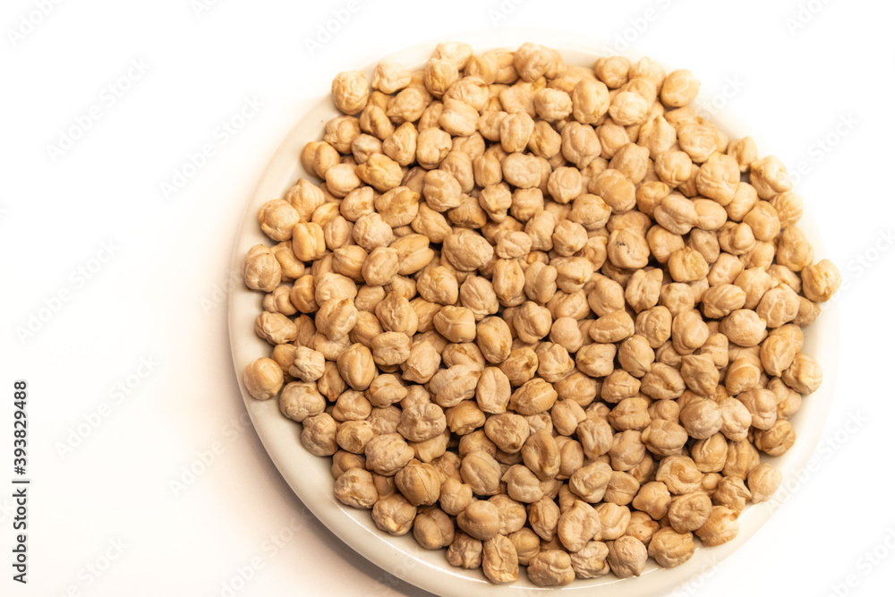 chickpeas from legume family in plate isolated on white background chickpeas from legume family in plate isolated on white background